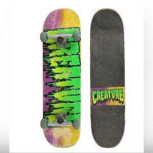 Creature Neon Drip Skateboard Deck with Purple-Orange Gradient